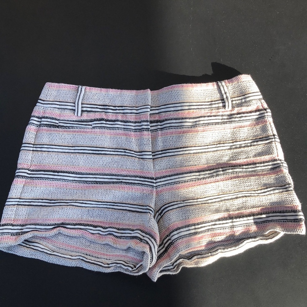 Gray, pink, black, and beige knitted shorts.